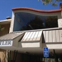 The walkway underneath the south side of the Center is highlighted by green support structures intended to represent a bamboo forest.